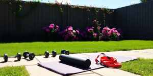 Backyard workout space with equipment.